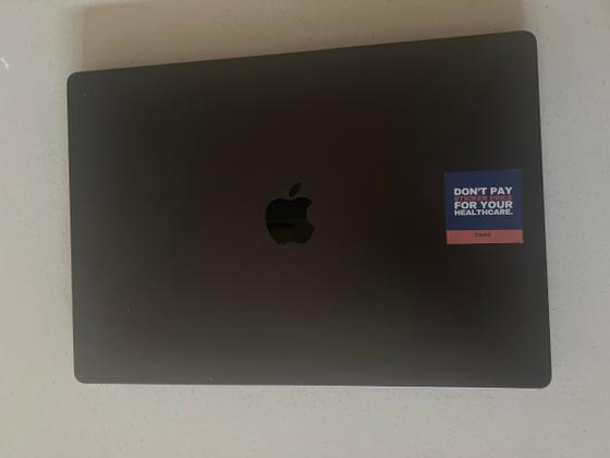 The stickers on "I am once again asking for your financial support." - Adam Hamdan (and Bernie), photographed by the seller