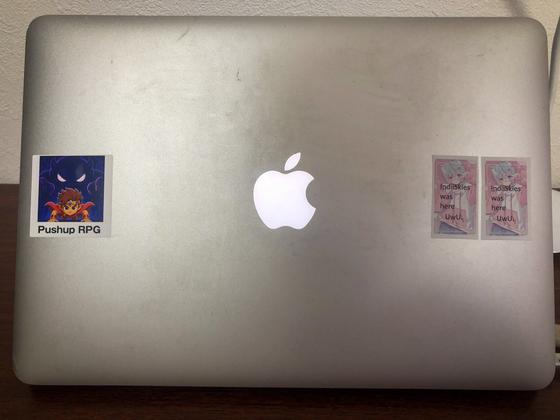 The stickers on Glowing Apple logo, 2012 MacBook Air - ten spots around it, photographed by the seller